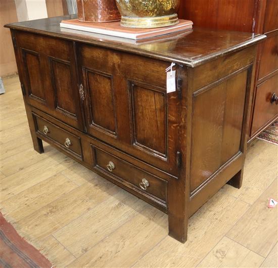 An oak mule chest with converted front doors W.128cm
